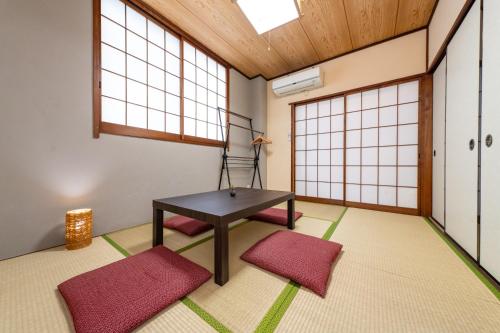 a room with a table and two windows at ON SALE 13 minutes by Haneda Airport train, 15 minutes walking distance by station, fully equipped with a record player, maximum 5 people in Tokyo