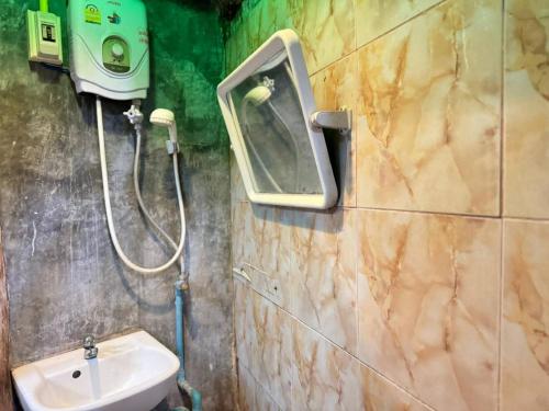 a bathroom with a toilet and a sink at Belvilla Baan Elephant Home in Chiang Mai