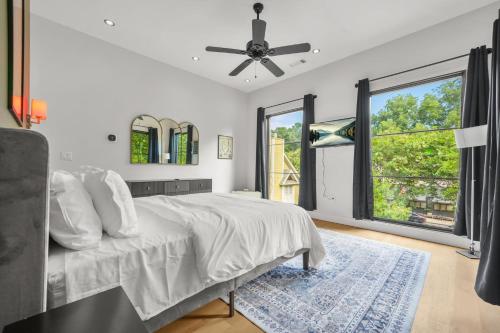 a bedroom with a bed and a ceiling fan at Music Soul House in Atlanta