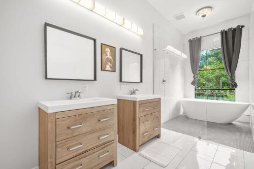 a white bathroom with a tub and a sink and a bath tub at Music Soul House in Atlanta