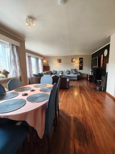 a living room with a table and a couch at Stryn Norway in Stryn