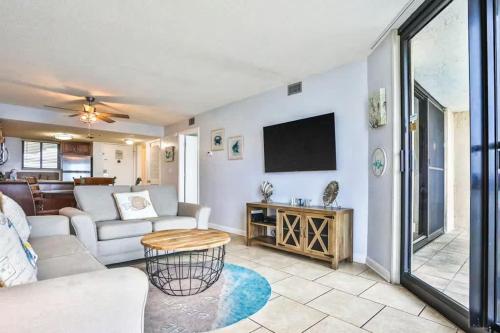 a living room with a couch and a tv at SunDestin Resort Unit 0615 in Destin