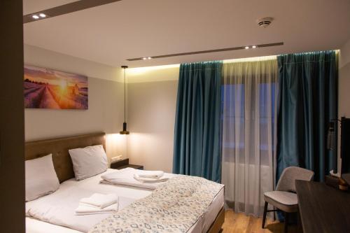 a hotel room with a bed and a table at ASD Hotel in Filderstadt