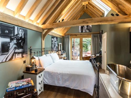 a bedroom with a large bed in a room at NoTwenty9 Bar and Restaurant in Burnham Market