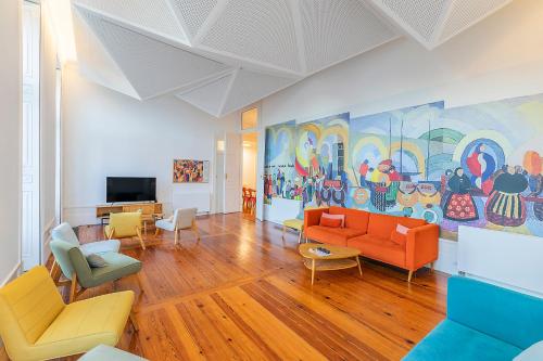 a living room with furniture and a painting on the wall at HI Vila do Conde - Pousada de Juventude in Vila do Conde