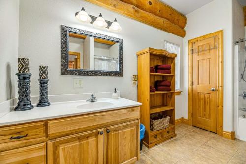 a bathroom with a sink and a mirror at Tetro Rock Retreat in Deadwood