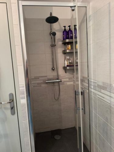a shower in a bathroom with a glass door at Hearttoart in Martigues