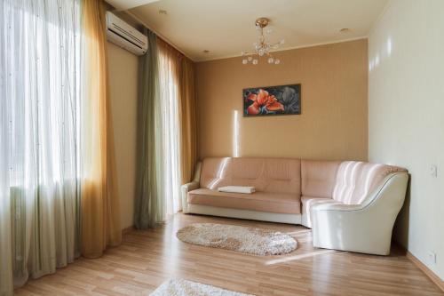 a living room with a couch and a rug at Two-bedroom Apartment on Pushkinskaia 54 in Kharkiv