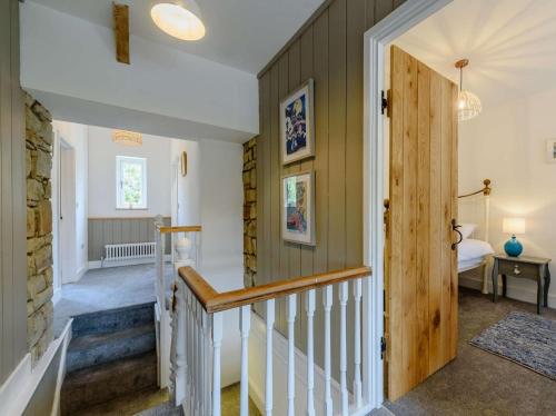 a hallway with a staircase in a house at 3 Bed in Llandysul oc-90019 in Llandyssiliogogo