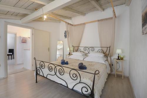 a bedroom with a bed with a metal frame at Casablanca-Brgulje in Brgulje