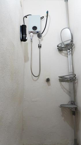 a bathroom with a blow dryer on the wall at Comfortable and Centrally Located Accommodation 2 in Altamira