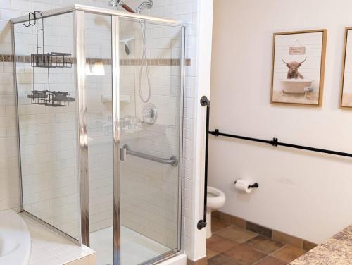 a glass shower in a bathroom with a toilet at Premium 3 Bed Top Floor Views in Vernon Township