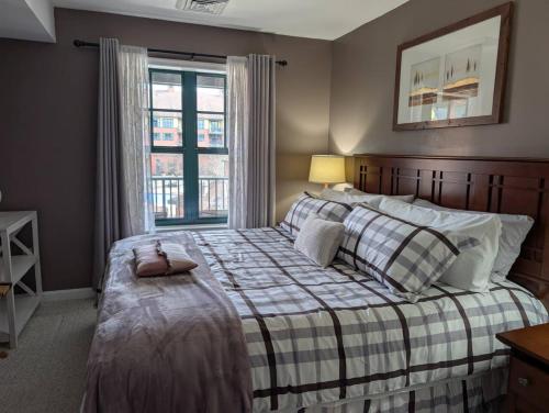a bedroom with a large bed with a window at Mt. Slope Great View 1 Bed Condo in Vernon Township