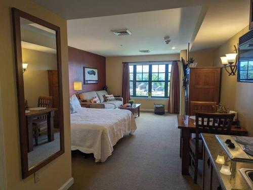 a bedroom with a bed and a living room at Rustic classic spacious Studio in Vernon Township