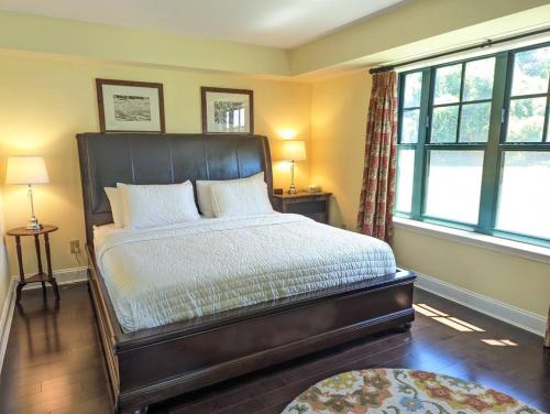 a bedroom with a bed and two windows at Great Views 2 Bed 2 Bath Updated in Vernon Township