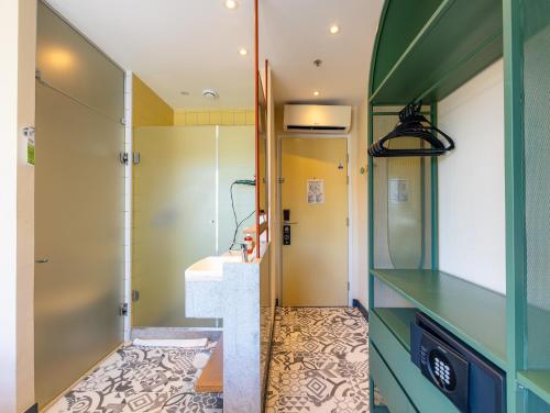 a bathroom with a sink and a counter top at B&B HOTEL Santos Dumont in Rio de Janeiro