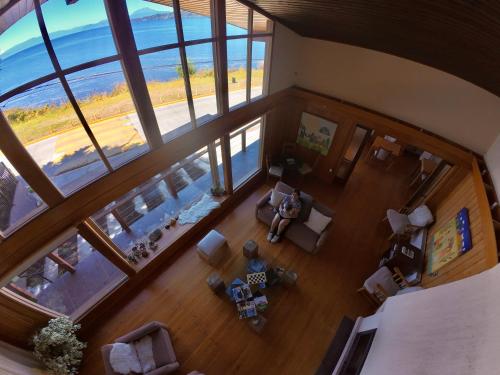 an overhead view of a living room with a view of the ocean at Amadeus Hotel Boutique in Frutillar