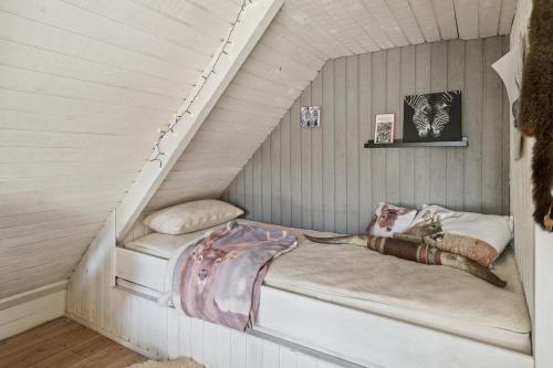 a room with a bed in a house at KATs FRISTED in Ebeltoft