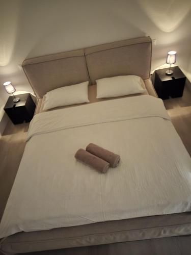 a bedroom with a bed with a roll on it at B&B Marysol in Arcegno