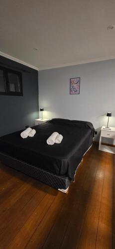a bedroom with a bed with two towels on it at Oasis Atlántida in Santa Clara del Mar