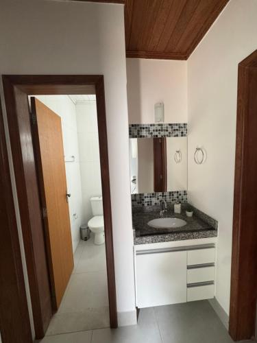 a bathroom with a sink and a toilet at Casa da Glória 2 in Diamantina