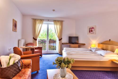 Postel nebo postele na pokoji v ubytování Hotel Garni Katnau