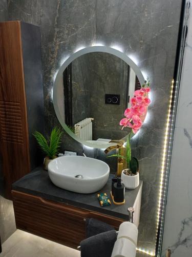 a bathroom with a sink and a mirror at The Samantha Guest House in Santo Stefano di Magra