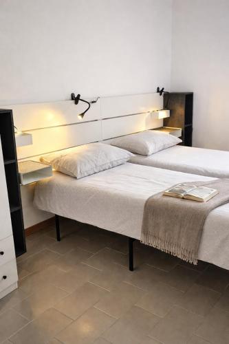 two beds sitting next to each other in a room at Terrazzo Panoramico Fronte Mare Zamponi in Civitanova Marche