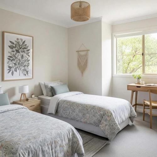 a bedroom with two beds and a window at VILLA du VERNET avec JACUZZI in Vernet