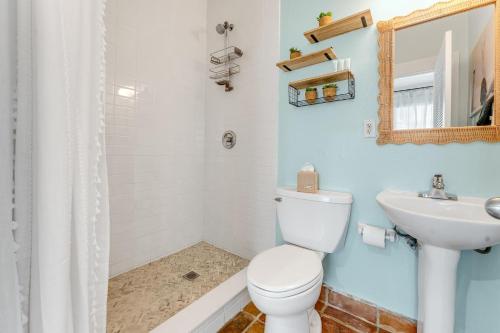 a bathroom with a toilet and a sink at AFTER HOURS @ Speakeasy Inn Key West! in Key West