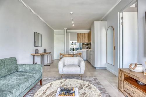 a living room with a couch and a chair at Caica Executives at Ellipse 4108 in Midrand