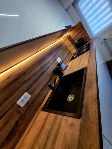 an overhead view of a living room with a wooden floor at Old Town Luxury 1 in Târgovişte