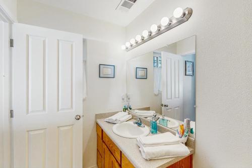 a bathroom with a sink and a mirror at 1 Mi to Boat Launch! Lake-View Chiloquin Retreat in Chiloquin