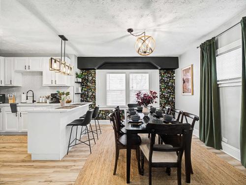 a kitchen and dining room with a table and chairs at Newly Renovated and Designed Near Downtown in Cleveland