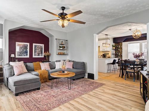 a living room with a couch and a table at Newly Renovated and Designed Near Downtown in Cleveland