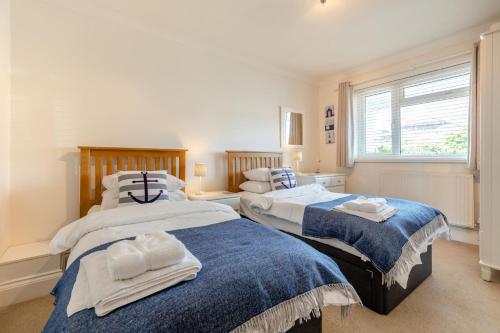a bedroom with two beds and a window at 3 Bed in Brixham oc-57892 in Brixham