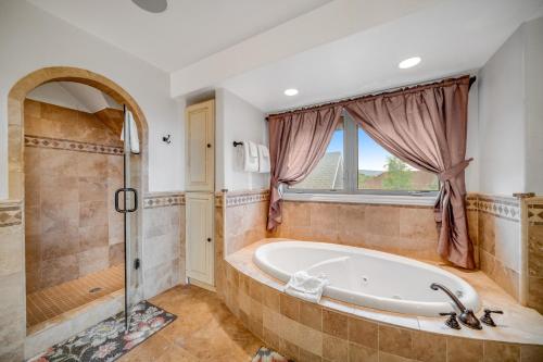 a large bathroom with a tub and a shower at Fun w/ Family! Mtn-View Gem w/ Deck in Driggs in Driggs
