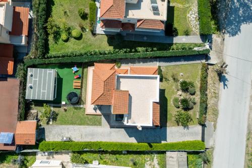 an overhead view of a house with grass at Filerimos Dream Villa in Ialysos