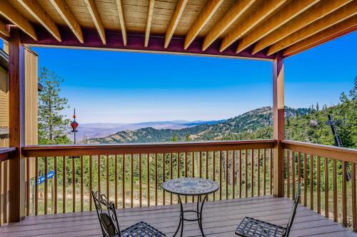 a patio with a table and chairs on a deck at Ski-In Ski-Out Studio at Bogus Basin in Boise