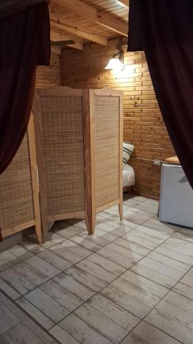 a room with two open doors in a room at El Druida 3 in Villa General Belgrano
