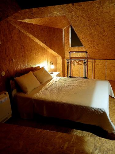 a bedroom with a large bed in a room at Green View Studios Coimbra in Coimbra