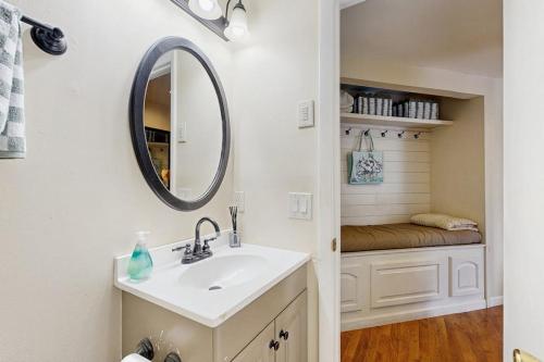 a bathroom with a sink and a mirror at The Treehouse at Banner Elk in Banner Elk