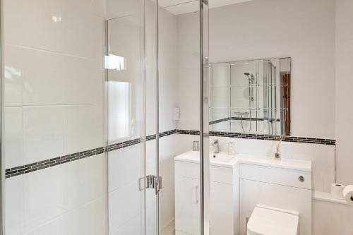 a bathroom with a shower and a toilet and a sink at 2 Bed in Somerton oc-w29203 in Somerton