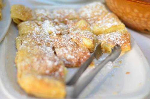 a plate of food with powdered sugar on it at Hotel Zografos in Paralia Katerinis