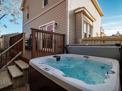 a hot tub on the back of a house at Cleveland Escape - Hot Tub - Karaoke Machine - Sleeps 12 in Cleveland
