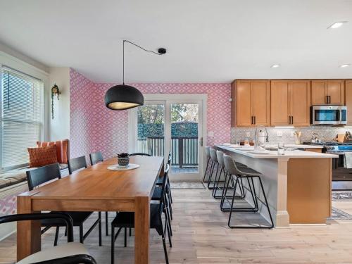 a kitchen and dining room with a table and chairs at Cleveland Escape - Hot Tub - Karaoke Machine - Sleeps 12 in Cleveland