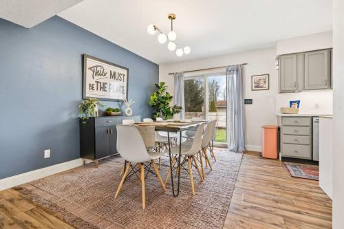a kitchen and dining room with a table and chairs at Spacious Northfield 4BR Escape near Cuyahoga Valley in Northfield