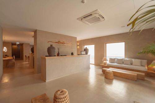 a living room with a couch and a table at Authentic Tavira Hotel in Tavira