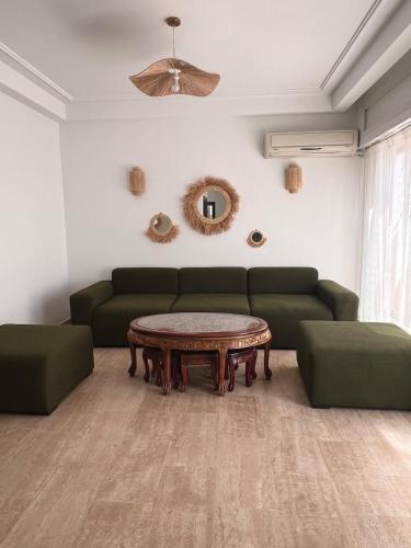 a living room with a couch and a coffee table at Central Urban Terrace in Rabat