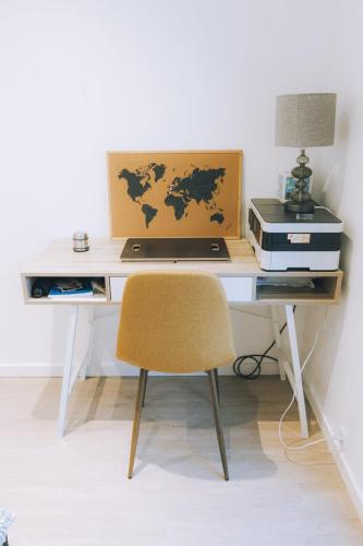 a desk with a laptop computer and a printer at High end 3 BR Spacious Villa for 6 guests in Norðskáli